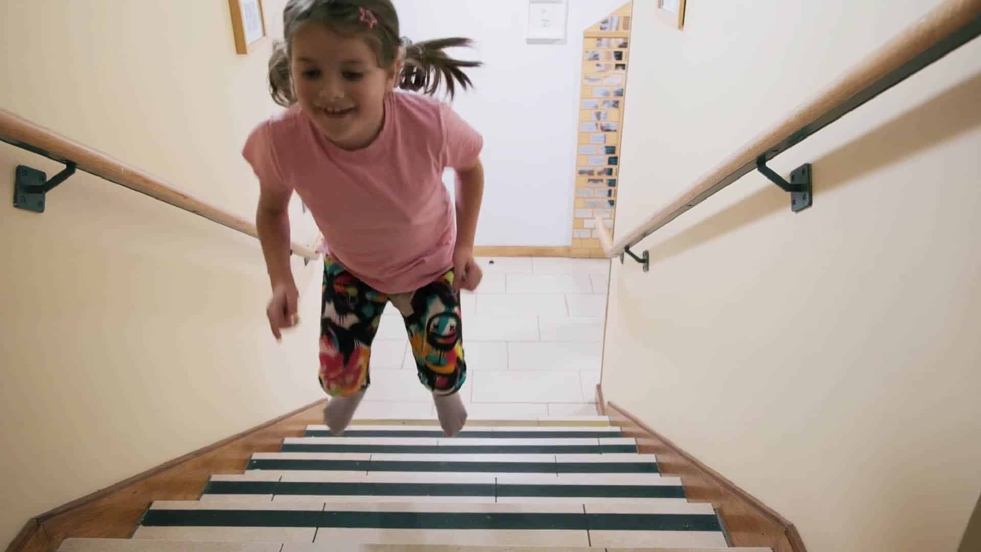 Child playing on stairs