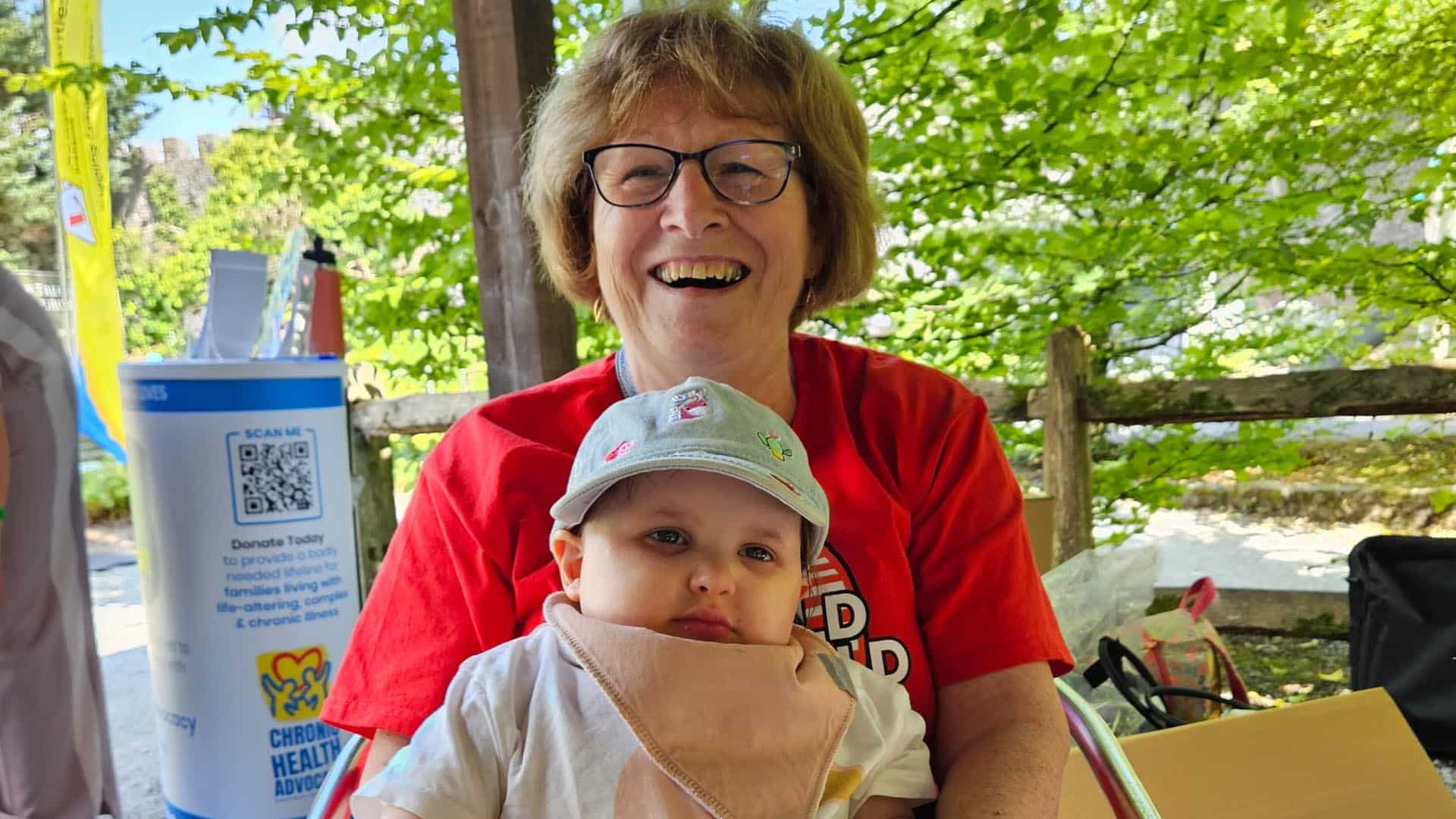 Child with staff member at reunion picnic